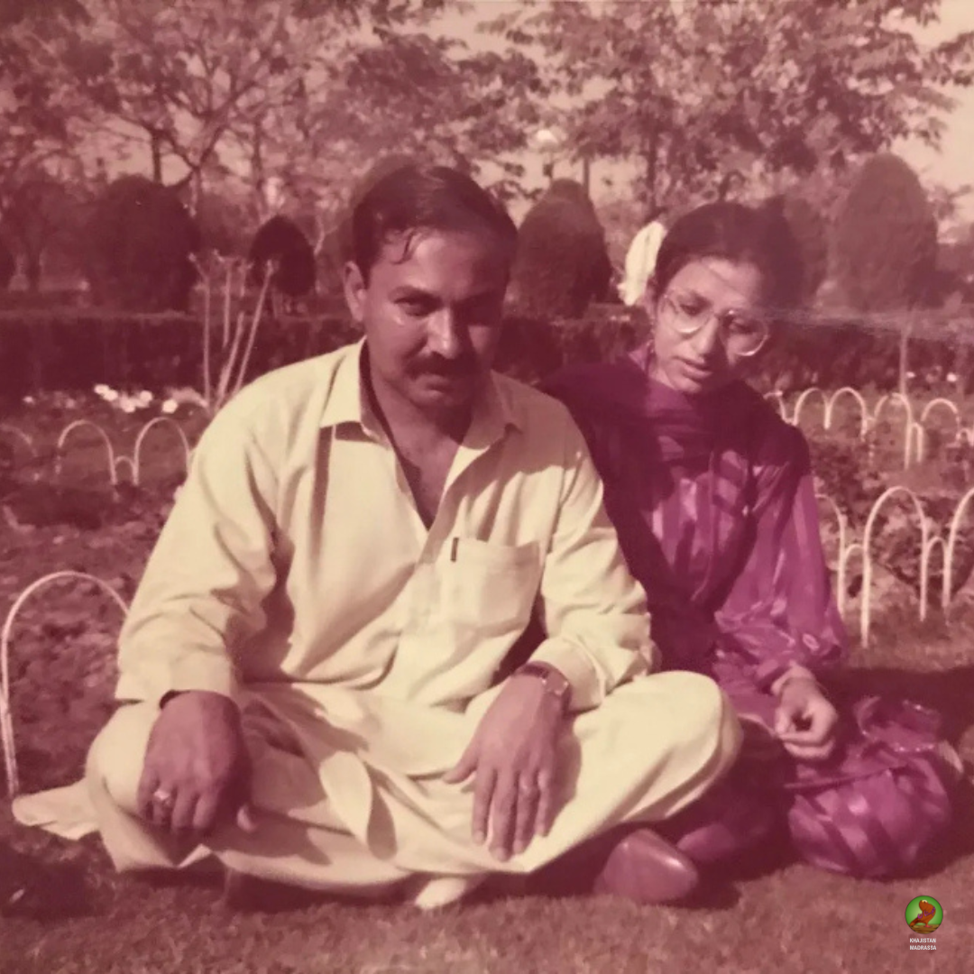 Vintage photo of a man and woman sitting on grass in a garden, Khajistan archiving