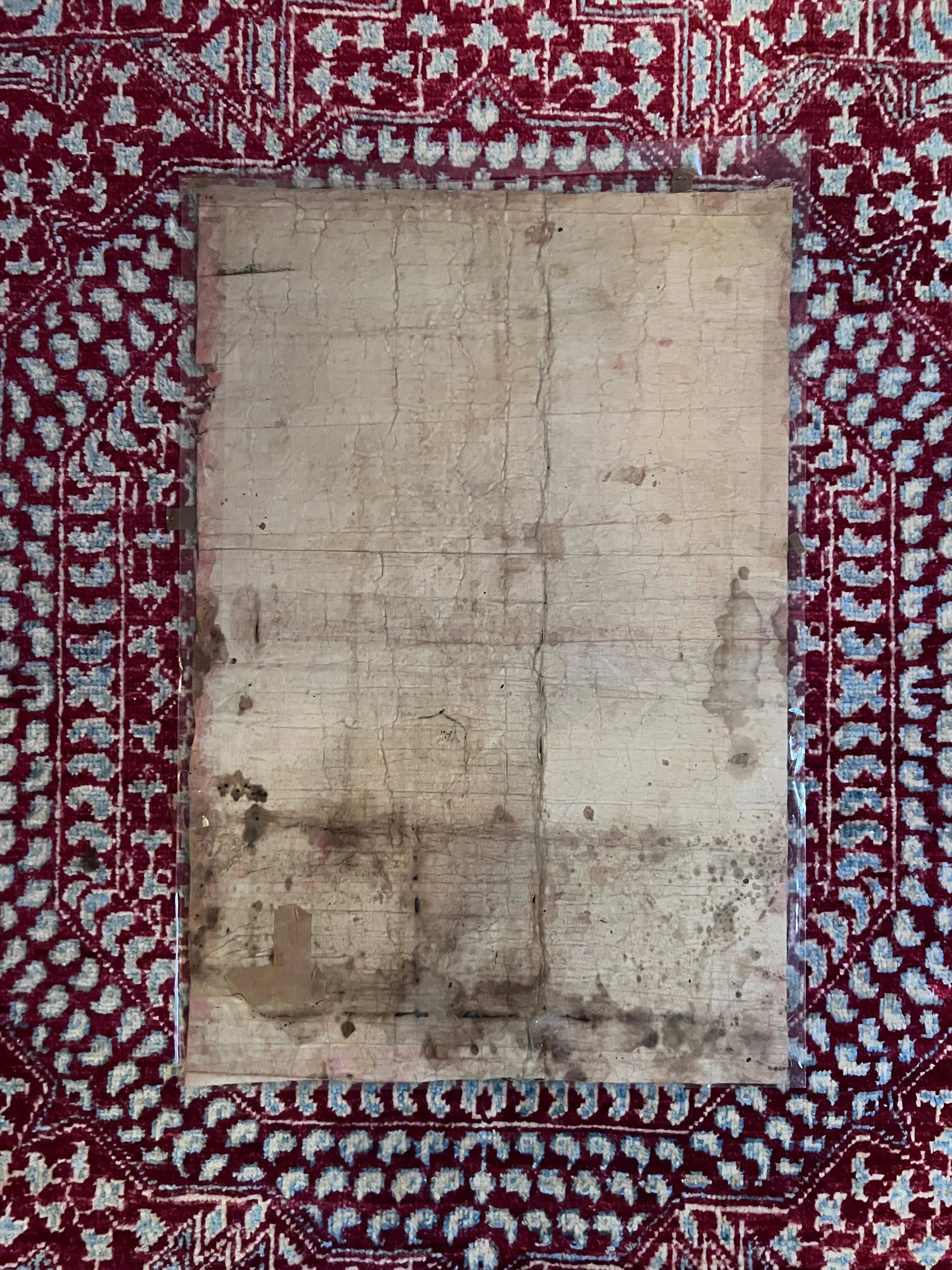 Old, worn-out paper inside a decorative red and white border